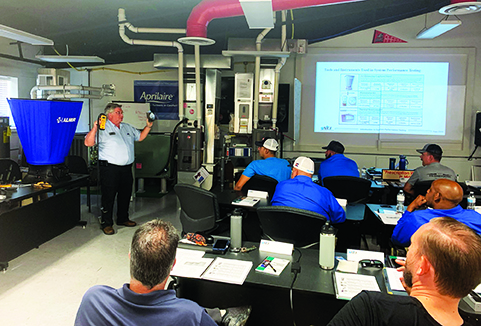 Pictured here is NCI's John Puryear teaching a live class to High-Performance HVAC contractors and technicians