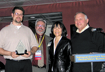 Rob Falke (right) presents David Richardson (left)with NCI’s first David Debien Technical Excellence award during Summit 2007 in Charleston, South Carolina. Pictured center left is Dominick Guarino and center right is David Debian’s widow, Suzanne Debien.