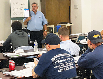 John Puryear leads the training during a recent R.E. Michel class.